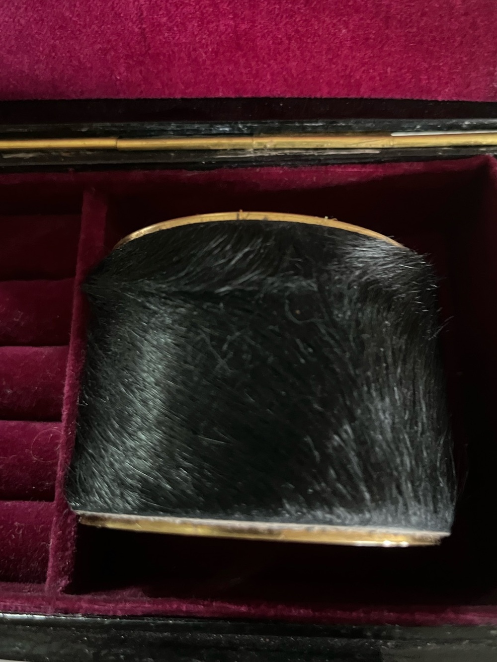 Calf Hair Cuff set into a polished gold 
  tone frame